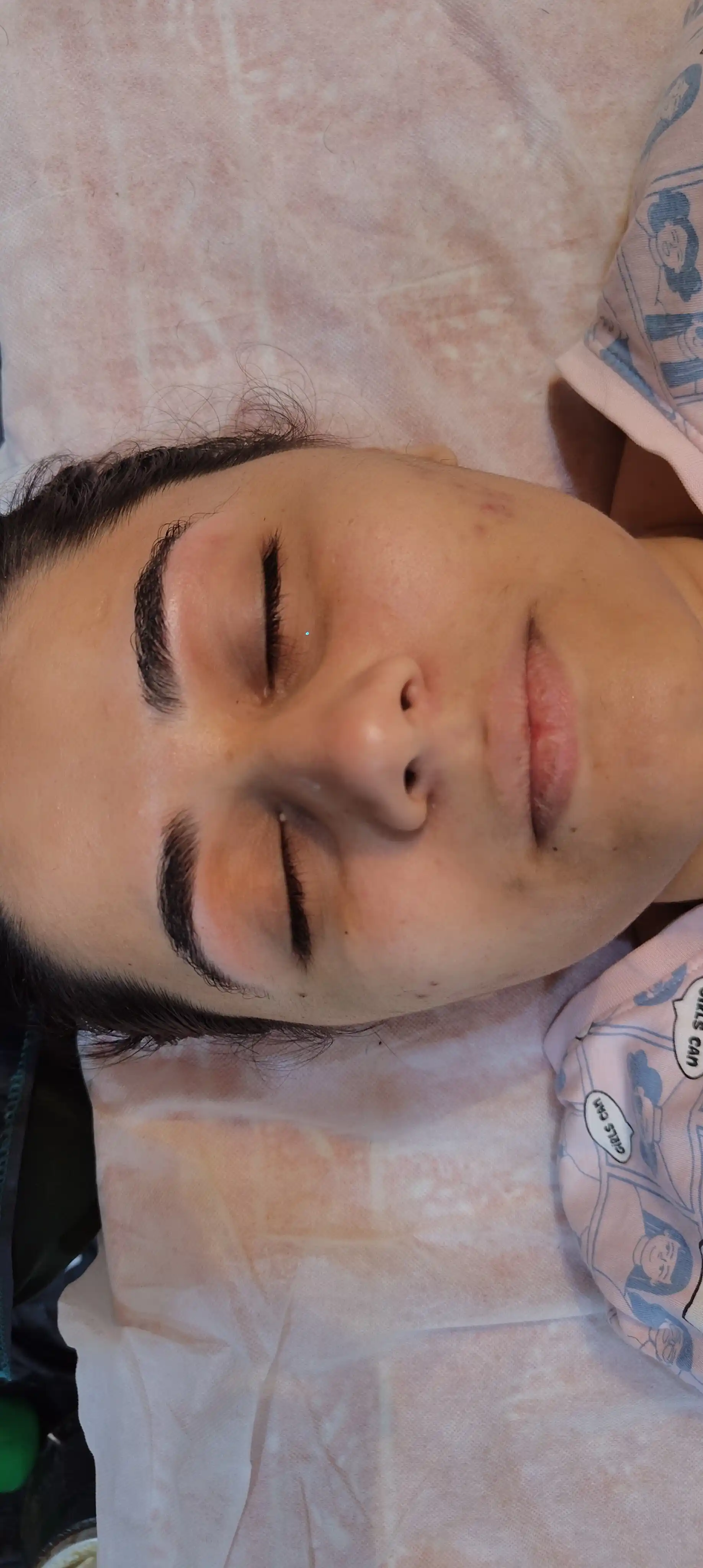 Client relaxed mid-way through a home facial appointment in Jaipur